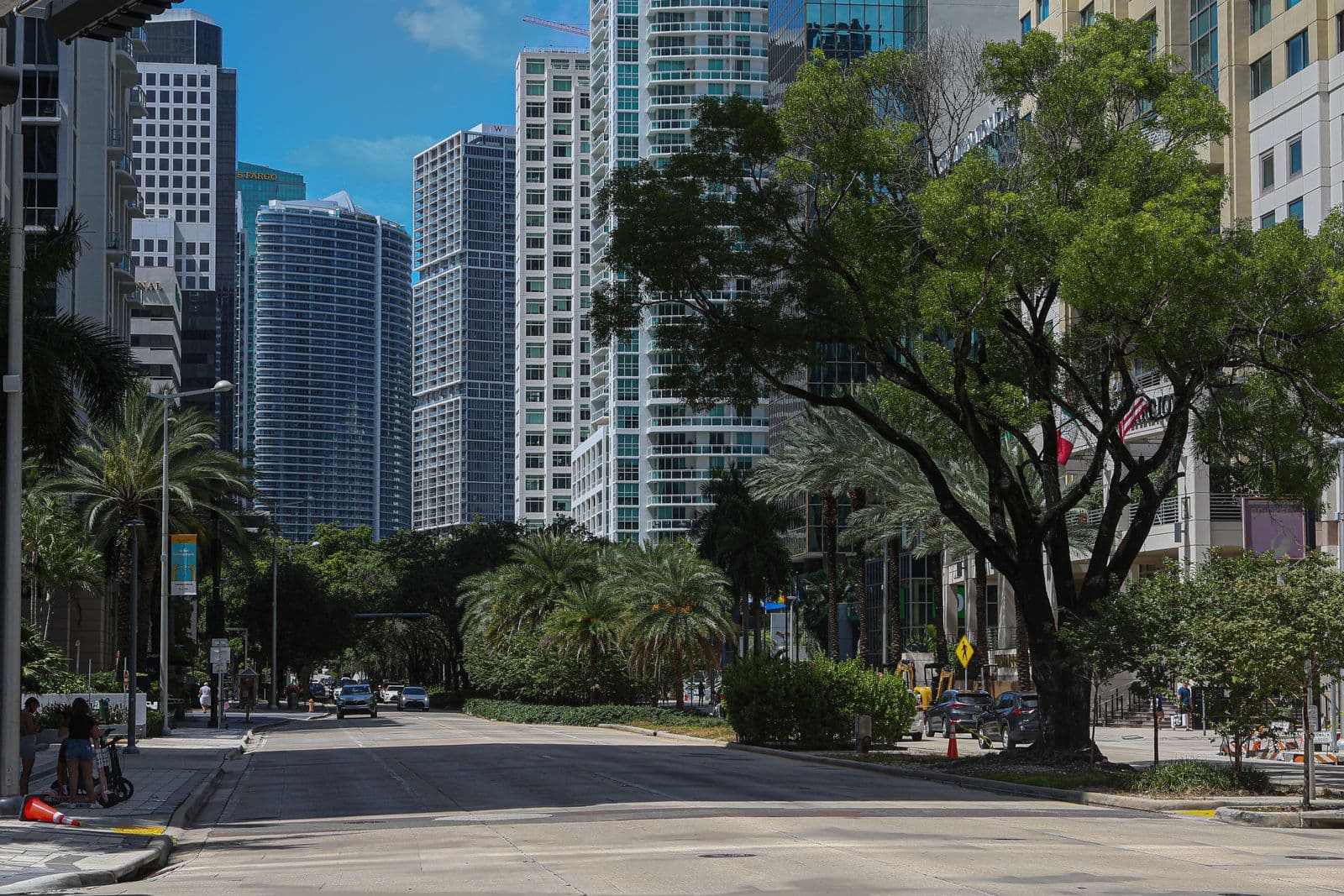 Downtown Miami street with skyscrapers and palm trees