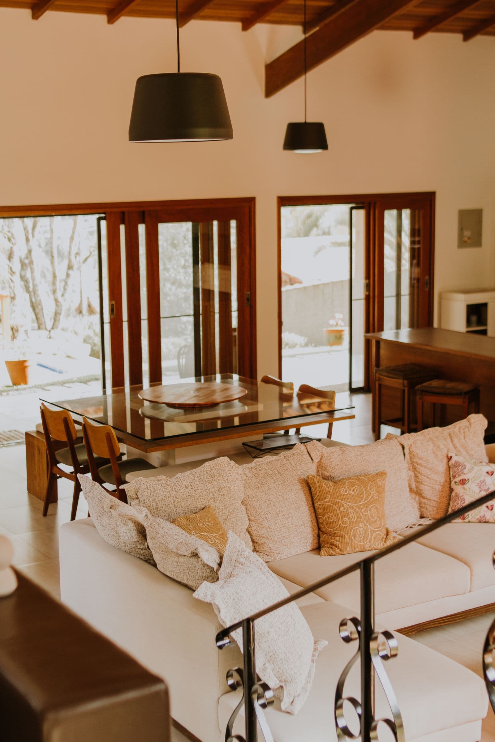 Warm lived-in living room with natural light and mixed furniture